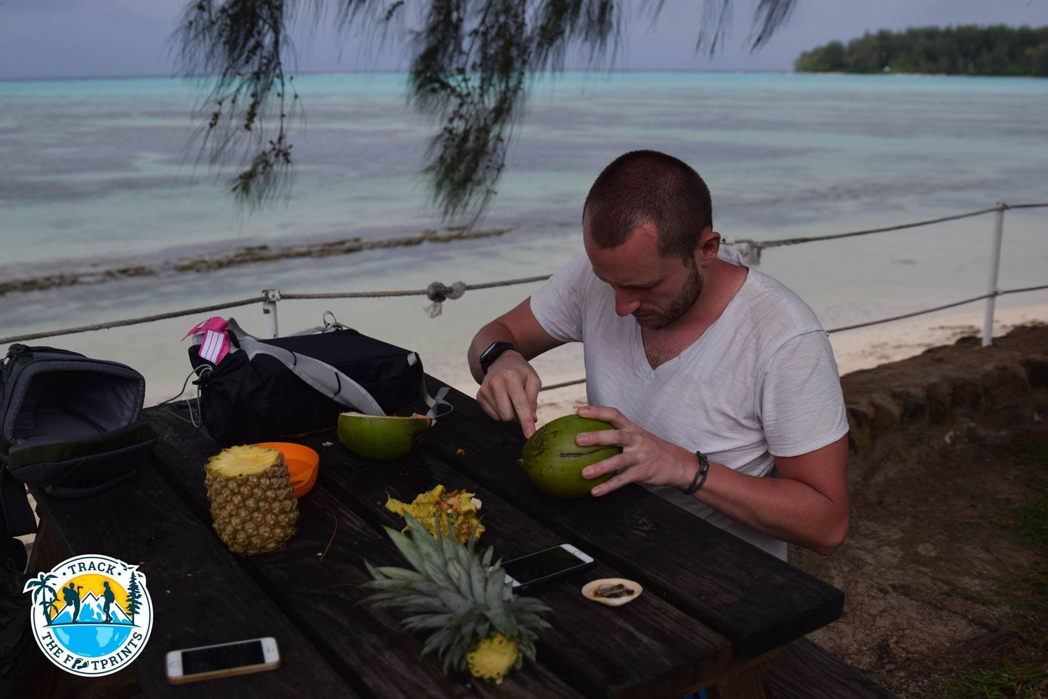 Trying to cut a coconut