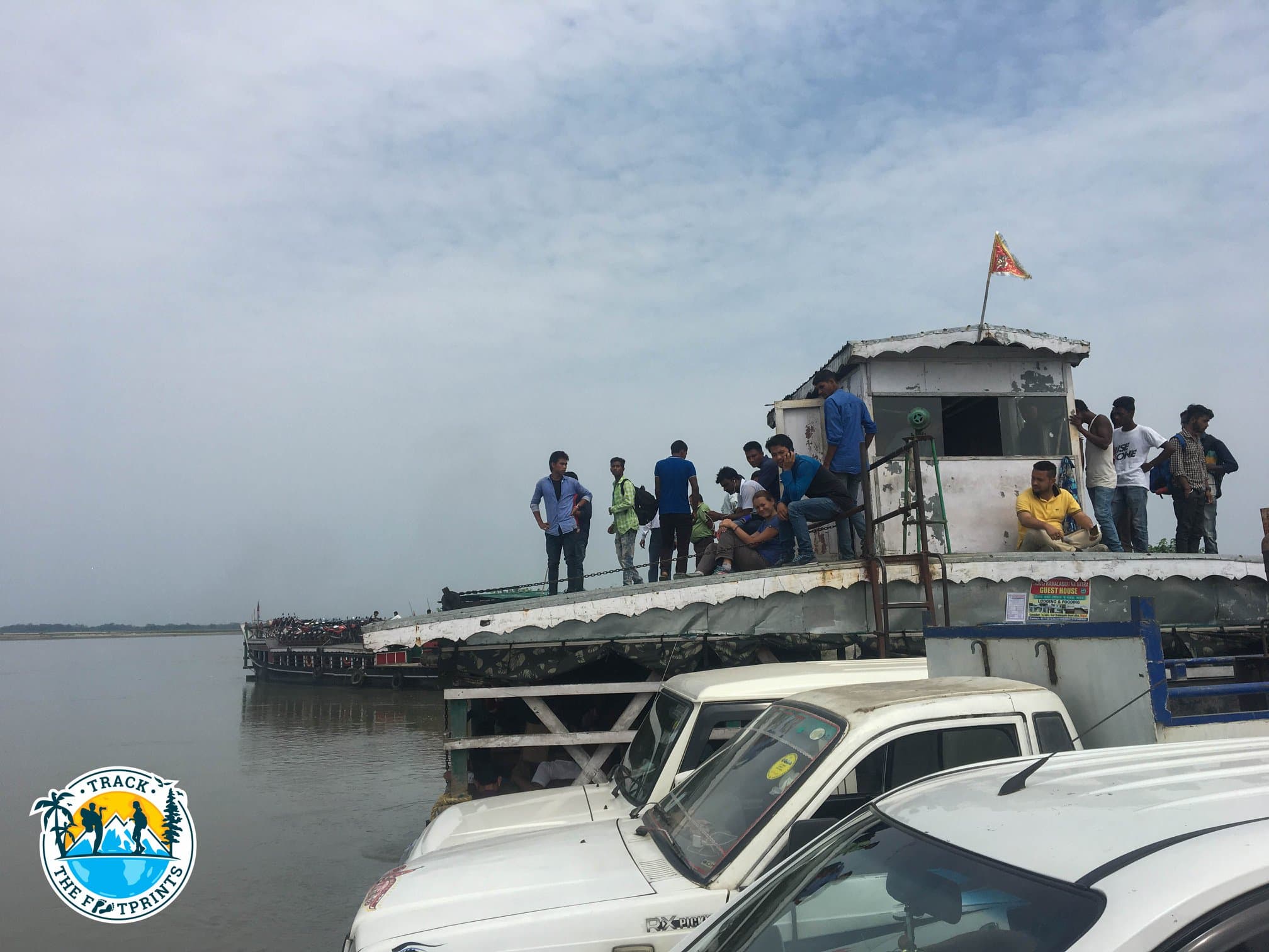 Leaving Majuli, Assam, India ... 2 hours of ferry to reach Assam main road. Augustina surrounded by mens...