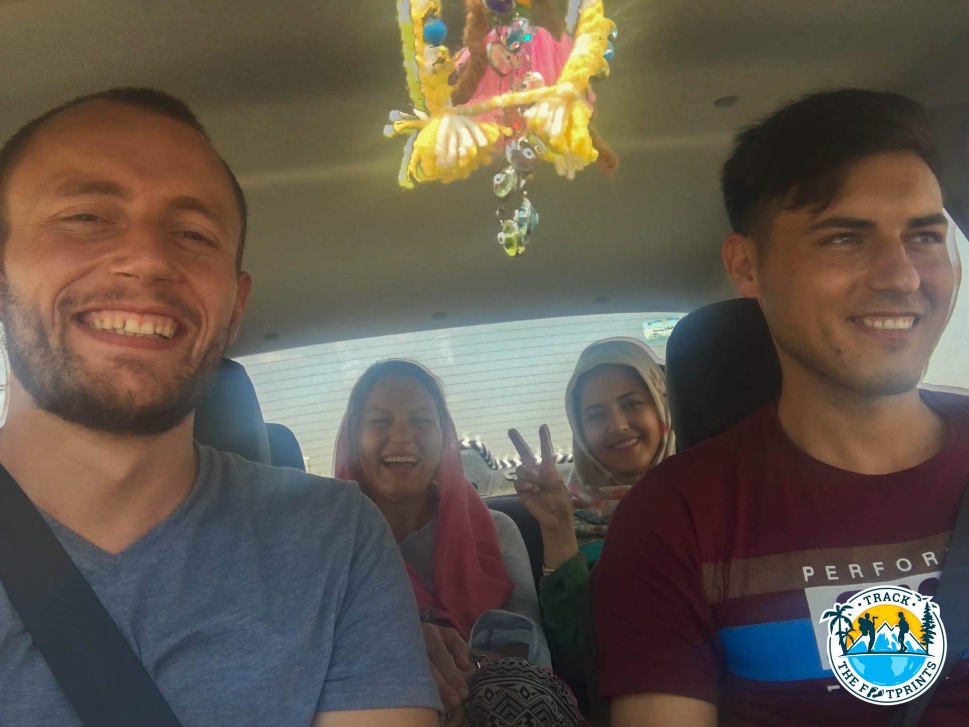 In the car to take the bus with the young married couple