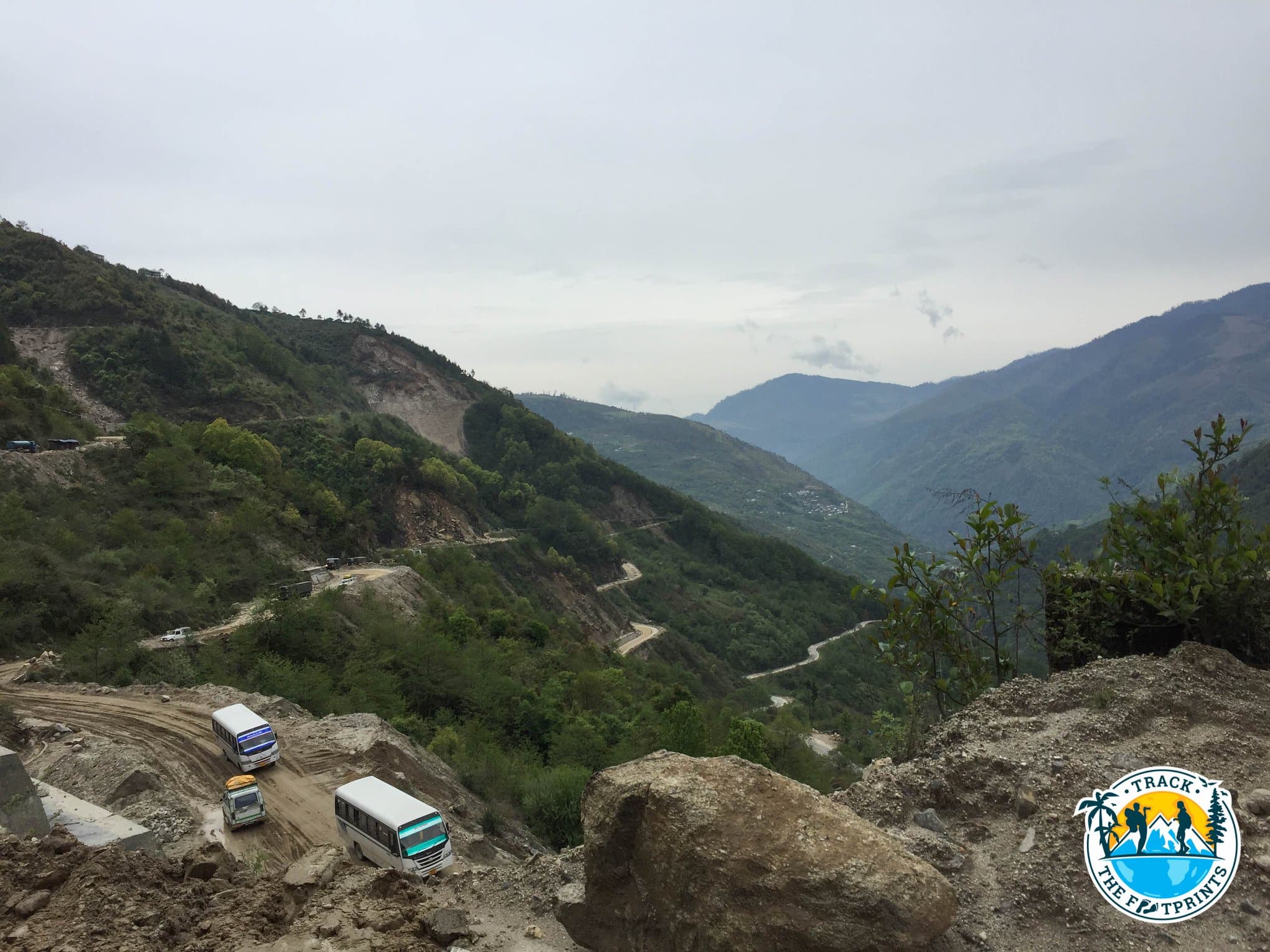 Some parts of the road are just a muddy footpath. And a lot of huge trucks take it every day.