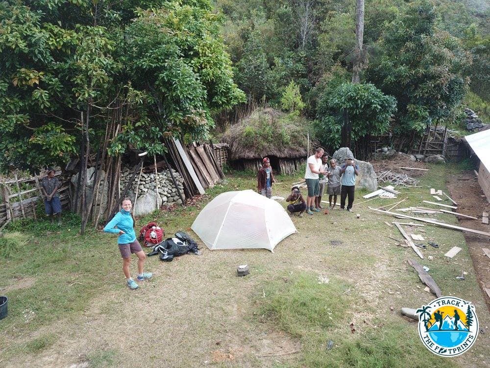 The Dani people house and our tent!